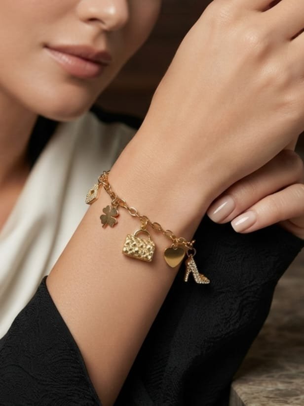 Bracelet Lolita – breloques dorées acier inoxydable – œil strass, trèfle, sac, cœur, escarpin