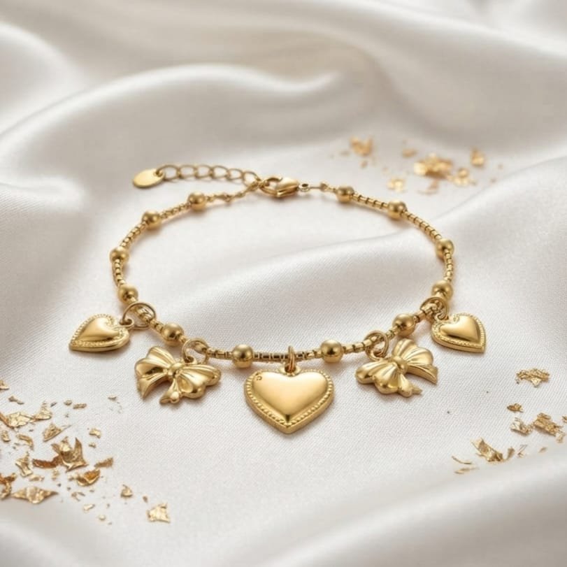 Bracelet Amour Éternel cœurs et nœuds papillon dorés acier inoxydable